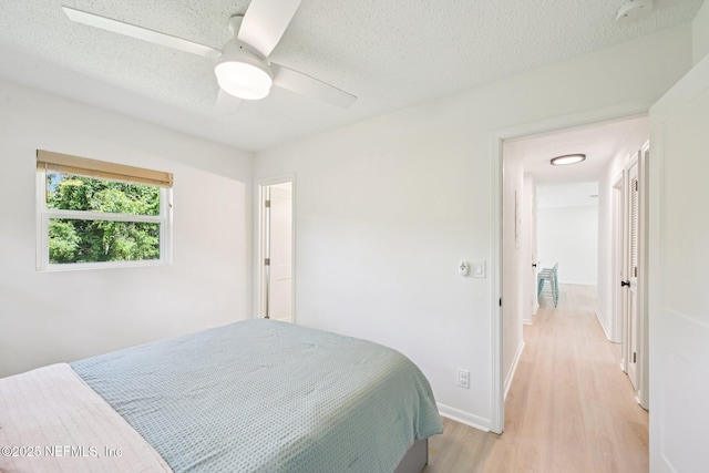 2619 Montreal St, Jacksonville, FL 32233 - bedroom with light wood finished floors, a textured ceiling, and a ceiling fan