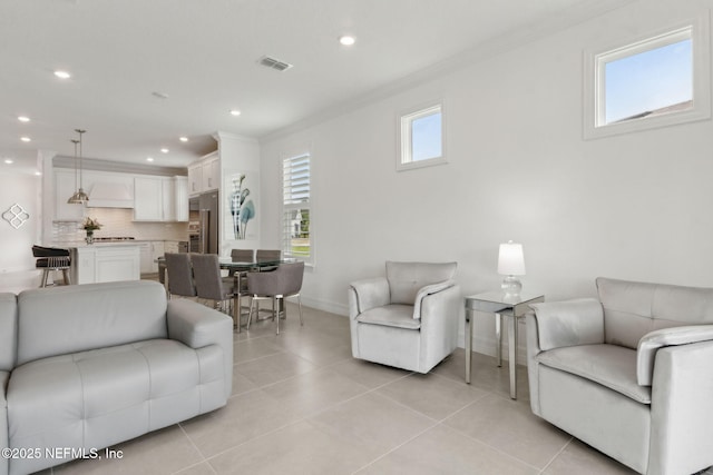 350 Tranquil Trail Cir, Yulee, FL 32097 - living room featuring crown molding, baseboards, recessed lighting, and light tile patterned flooring