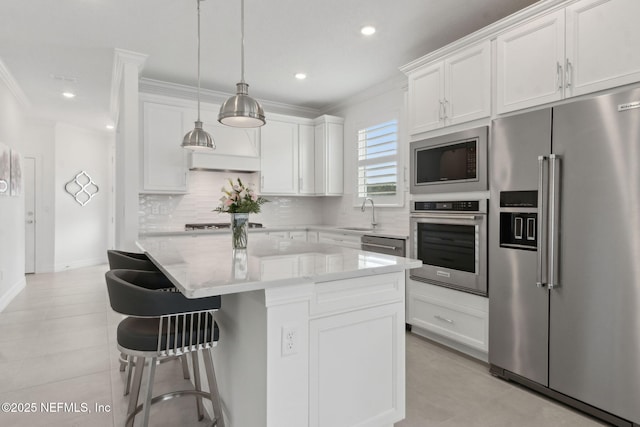 350 Tranquil Trail Cir, Yulee, FL 32097 - kitchen with appliances with stainless steel finishes, crown molding, white cabinets, backsplash, and recessed lighting