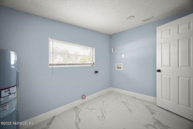 361 Mercury Dr, Orange Park, FL 32073 - laundry room with water heater, washer hookup, a textured ceiling, and light marble finish floors