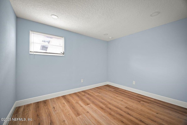 361 Mercury Dr, Orange Park, FL 32073 - empty room with wood finished floors and a textured ceiling