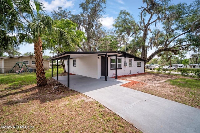 361 Mercury Dr, Orange Park, FL 32073 - view of front facade featuring concrete driveway and a carport