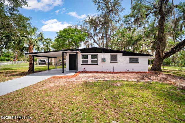 361 Mercury Dr, Orange Park, FL 32073 - mid-century inspired home featuring concrete driveway and a carport