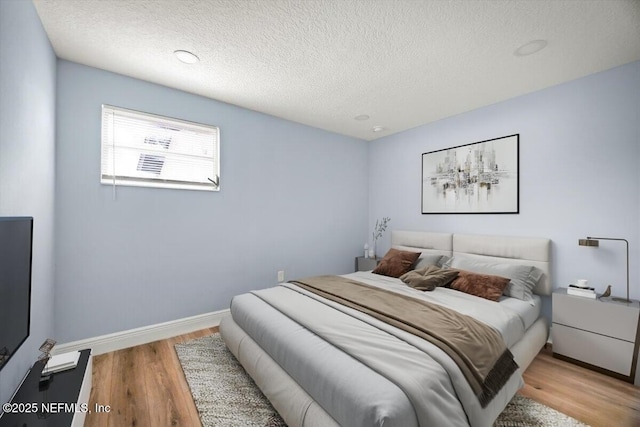 361 Mercury Dr, Orange Park, FL 32073 - bedroom featuring a textured ceiling and wood finished floors