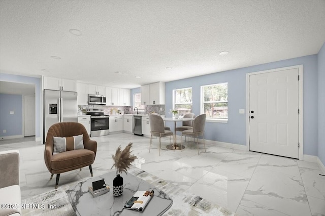 361 Mercury Dr, Orange Park, FL 32073 - living room with a textured ceiling and light marble finish floors