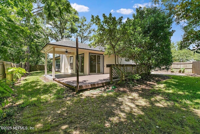 175 Del Prado Dr, Ponte Vedra Beach, FL 32082 - back of house featuring a ceiling fan, a fenced backyard, a wooden deck, and a chimney
