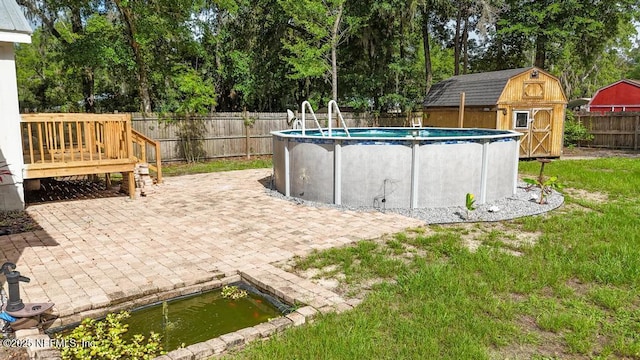 1514 Thomas St, Green Cove Springs, FL 32043 - view of swimming pool featuring a fenced backyard, view of scattered trees, and a patio area