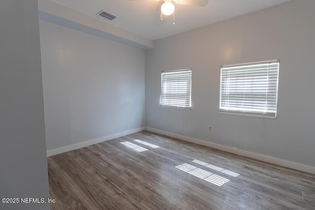 1514 Thomas St, Green Cove Springs, FL 32043 - empty room featuring a ceiling fan, wood finished floors, and baseboards