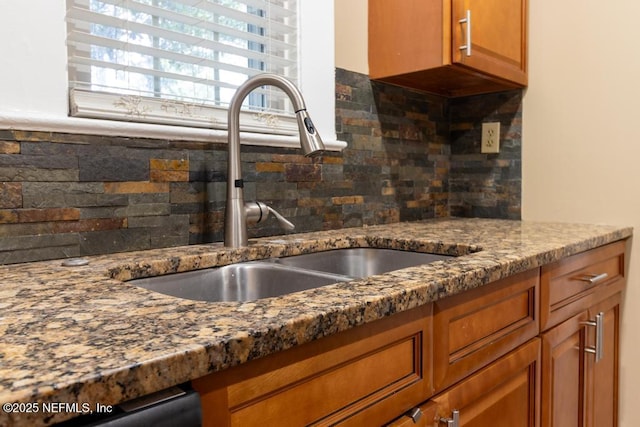 1514 Thomas St, Green Cove Springs, FL 32043 - kitchen featuring a sink, tasteful backsplash, dark stone counters, and brown cabinets