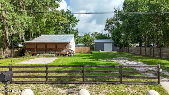 1514 Thomas St, Green Cove Springs, FL 32043 - view of yard with driveway and a detached garage