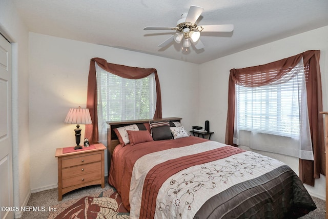 10121 SW 61st Terrace Rd, Ocala, FL 34476 - bedroom with light carpet and a ceiling fan
