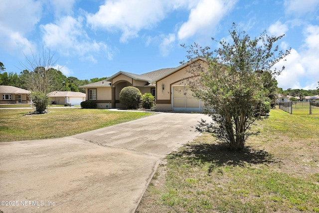 10121 SW 61st Terrace Rd, Ocala, FL 34476 - view of front of house featuring concrete driveway, stucco siding, and a garage