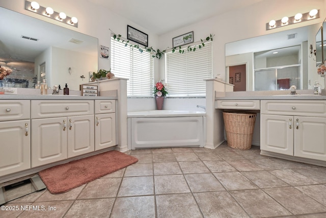 10121 SW 61st Terrace Rd, Ocala, FL 34476 - bathroom with a shower stall, a garden tub, and two vanities