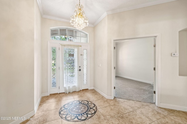 3975 Royal Pines Dr, Orange Park, FL 32065 - carpeted foyer featuring a chandelier, crown molding, and tile patterned flooring