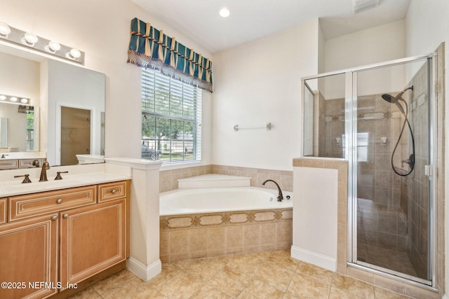 3975 Royal Pines Dr, Orange Park, FL 32065 - bathroom featuring vanity, a garden tub, tile patterned flooring, and a shower stall
