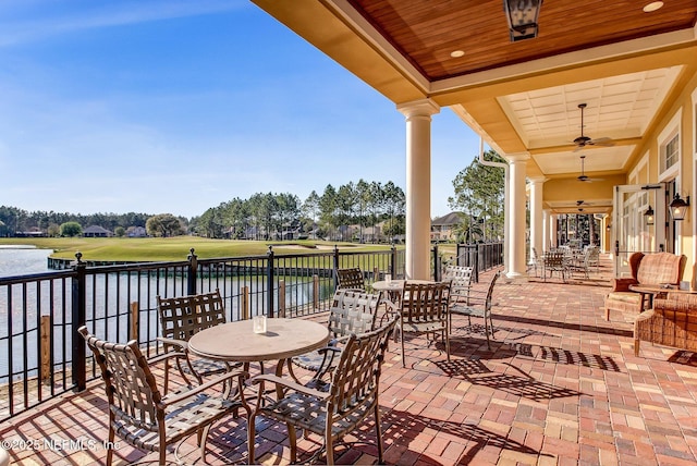 3975 Royal Pines Dr, Orange Park, FL 32065 - view of patio / terrace with a water view, a ceiling fan, and outdoor dining space