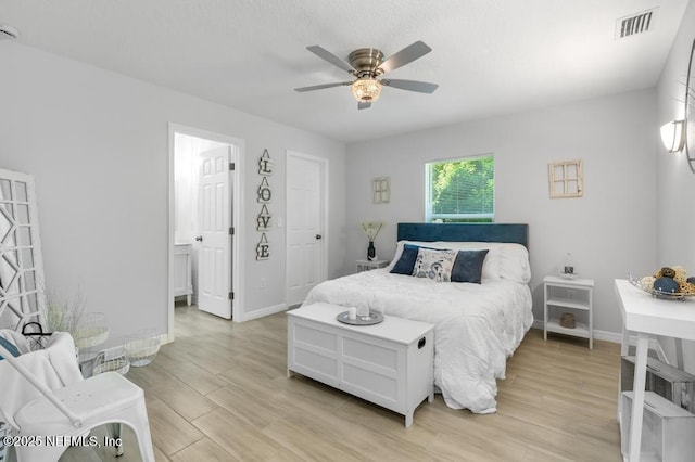 6217 Lobelia St, Jacksonville, FL 32209 - bedroom with light wood-style floors and ceiling fan