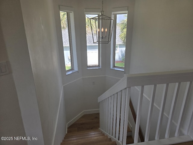 7 Sabor De Sal Rd, Saint Augustine, FL 32080 - staircase featuring wood finished floors and a chandelier