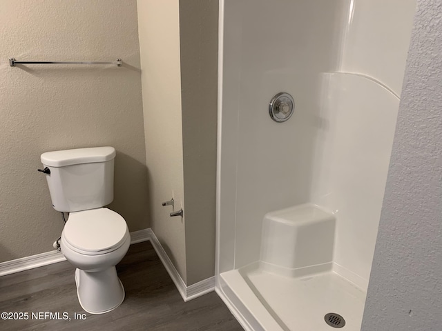10961 Burnt Mill Rd Unit 917, Jacksonville, FL 32256 - full bathroom featuring wood finished floors, a shower stall, and a textured wall