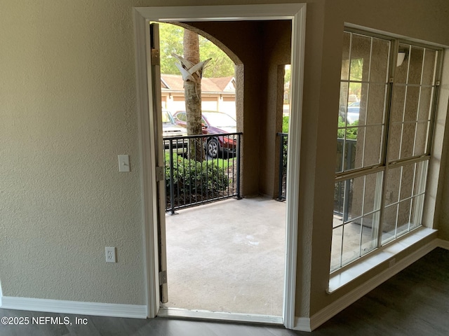 10961 Burnt Mill Rd Unit 917, Jacksonville, FL 32256 - doorway to outside with a textured wall and arched walkways