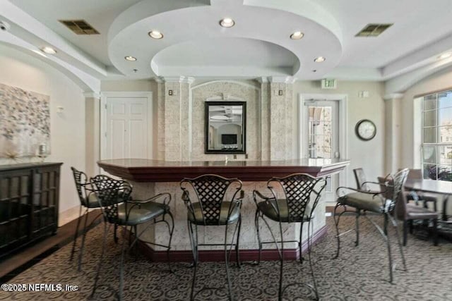 10961 Burnt Mill Rd Unit 917, Jacksonville, FL 32256 - bar area featuring recessed lighting and a tray ceiling
