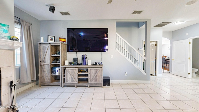 2032 Trailing Pines Way, Fleming Island, FL 32003 - living room with stairs, tile patterned flooring, and baseboards