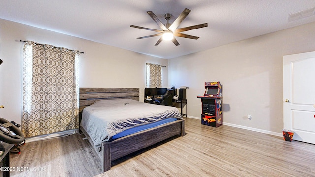 2032 Trailing Pines Way, Fleming Island, FL 32003 - bedroom featuring wood finished floors, ceiling fan, and baseboards