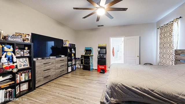 2032 Trailing Pines Way, Fleming Island, FL 32003 - bedroom with light wood-style flooring and a ceiling fan