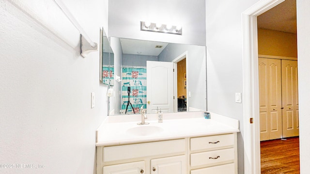 2032 Trailing Pines Way, Fleming Island, FL 32003 - full bathroom with vanity and wood finished floors