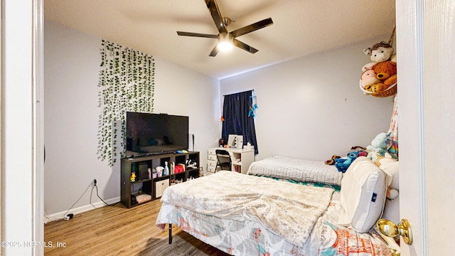 2032 Trailing Pines Way, Fleming Island, FL 32003 - bedroom with wood finished floors, lofted ceiling, a ceiling fan, and baseboards