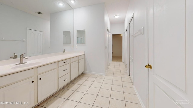 2032 Trailing Pines Way, Fleming Island, FL 32003 - full bathroom with double vanity, tile patterned flooring, and baseboards