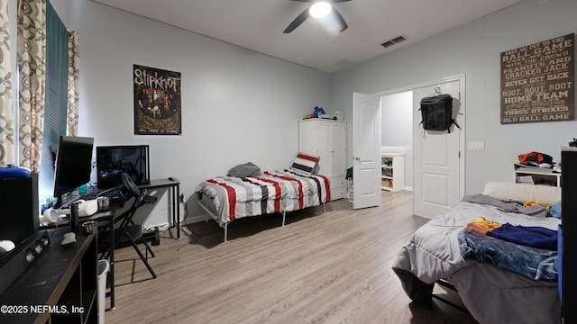 2032 Trailing Pines Way, Fleming Island, FL 32003 - bedroom with wood finished floors, ceiling fan, and baseboards