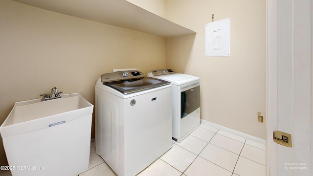2032 Trailing Pines Way, Fleming Island, FL 32003 - laundry area featuring washer and dryer and light tile patterned floors