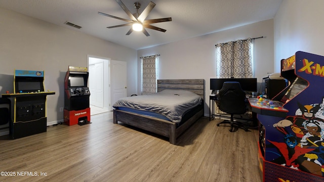 2032 Trailing Pines Way, Fleming Island, FL 32003 - bedroom with wood finished floors and ceiling fan