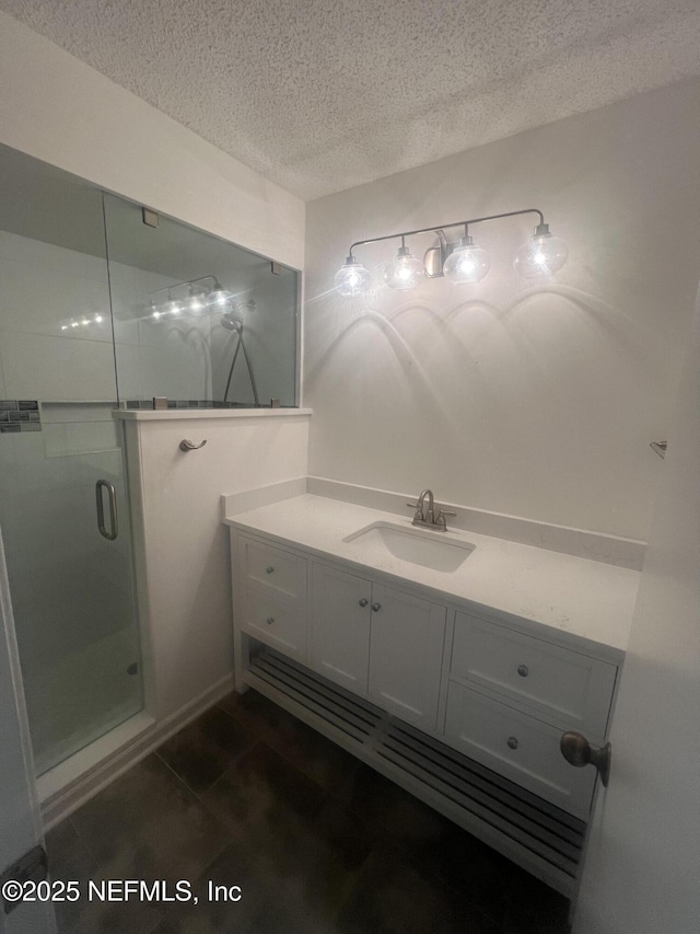 1535 Summer Sands Dr, Neptune Beach, FL 32266 - bathroom featuring a textured ceiling, a stall shower, and vanity