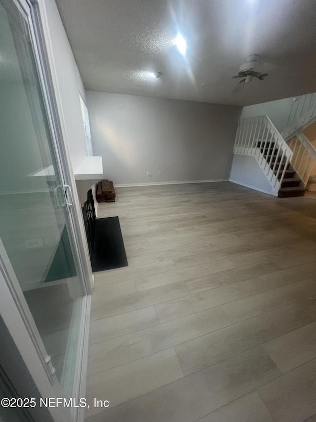 1535 Summer Sands Dr, Neptune Beach, FL 32266 - empty room with light wood-type flooring and a textured ceiling