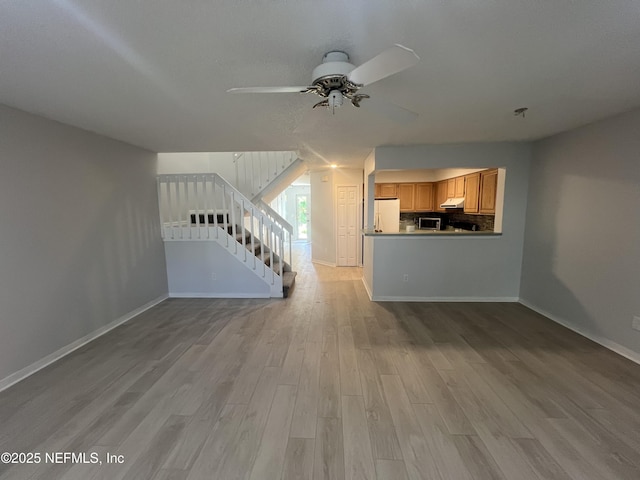1535 Summer Sands Dr, Neptune Beach, FL 32266 - unfurnished living room featuring stairs, ceiling fan, and light wood-style floors