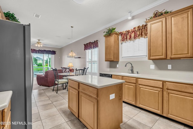 11582 Wynnfield Lakes Cir, Jacksonville, FL 32246 - kitchen with freestanding refrigerator, a ceiling fan, light tile patterned floors, a center island, and light countertops