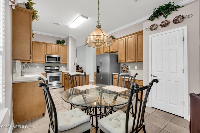 11582 Wynnfield Lakes Cir, Jacksonville, FL 32246 - dining room with a chandelier, light tile patterned floors, and ornamental molding