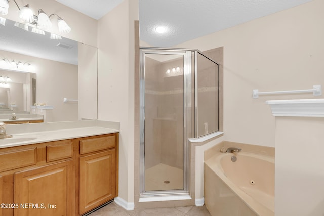 11582 Wynnfield Lakes Cir, Jacksonville, FL 32246 - bathroom with vanity, a tub with jets, a stall shower, tile patterned flooring, and a textured ceiling