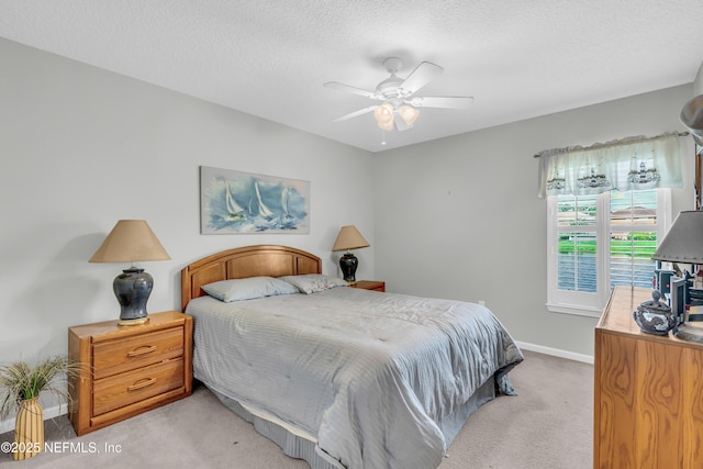 11582 Wynnfield Lakes Cir, Jacksonville, FL 32246 - bedroom featuring light colored carpet, a textured ceiling, and a ceiling fan
