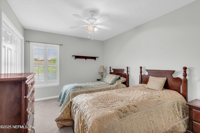 11582 Wynnfield Lakes Cir, Jacksonville, FL 32246 - carpeted bedroom featuring a textured ceiling and a ceiling fan