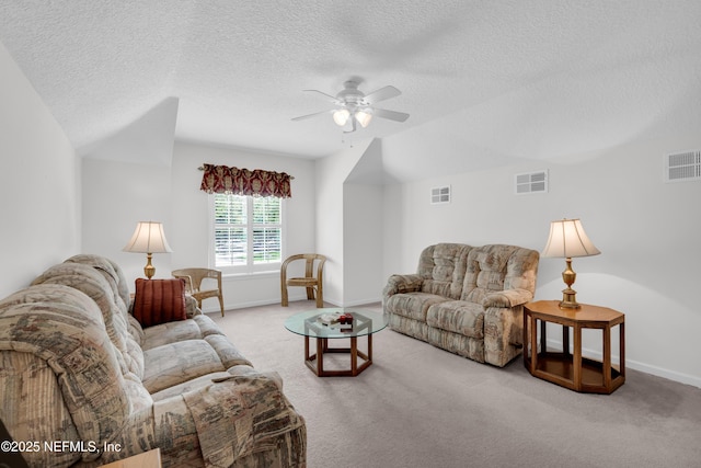 11582 Wynnfield Lakes Cir, Jacksonville, FL 32246 - living room featuring ceiling fan, a textured ceiling, carpet flooring, and vaulted ceiling