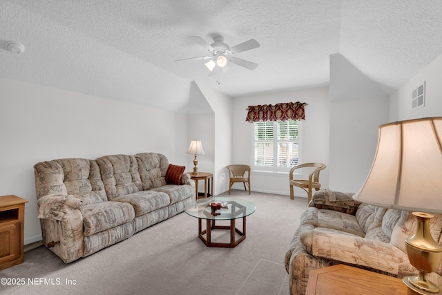 11582 Wynnfield Lakes Cir, Jacksonville, FL 32246 - living area featuring a textured ceiling, carpet, and ceiling fan