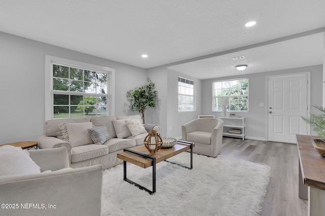9076 1st Ave, Jacksonville, FL 32208 - living area with light wood-type flooring and recessed lighting