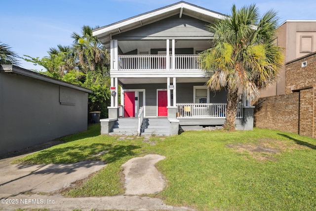 918 King St, Jacksonville, FL 32204 - view of front facade featuring a balcony, covered porch, and a front yard