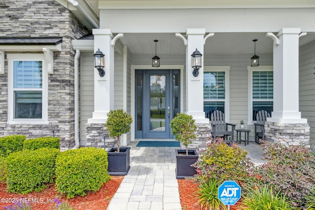 95158 Sandy Pointe Dr, Fernandina Beach, FL 32034 - doorway to property with a porch and stone siding