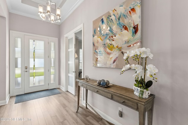 95158 Sandy Pointe Dr, Fernandina Beach, FL 32034 - foyer entrance featuring a chandelier, ornamental molding, and wood finished floors
