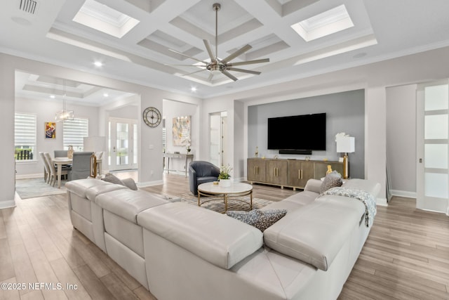 95158 Sandy Pointe Dr, Fernandina Beach, FL 32034 - living area with light wood-style floors, crown molding, a ceiling fan, coffered ceiling, and beamed ceiling