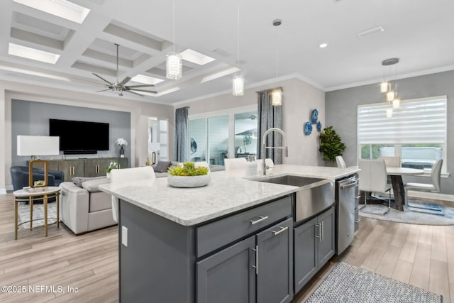 95158 Sandy Pointe Dr, Fernandina Beach, FL 32034 - kitchen featuring light wood finished floors, gray cabinetry, dishwasher, a kitchen island with sink, and ceiling fan